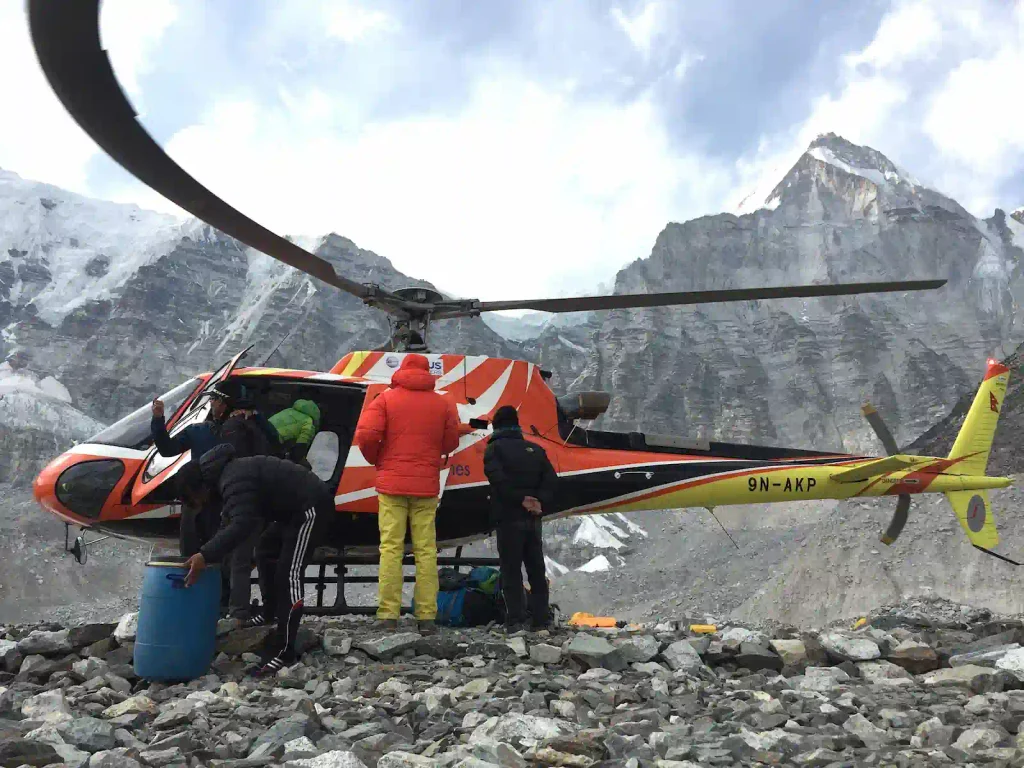 Altitude sickness in nepal: symptoms, prevention & treatment 2 trekkers being rescued through helicopter